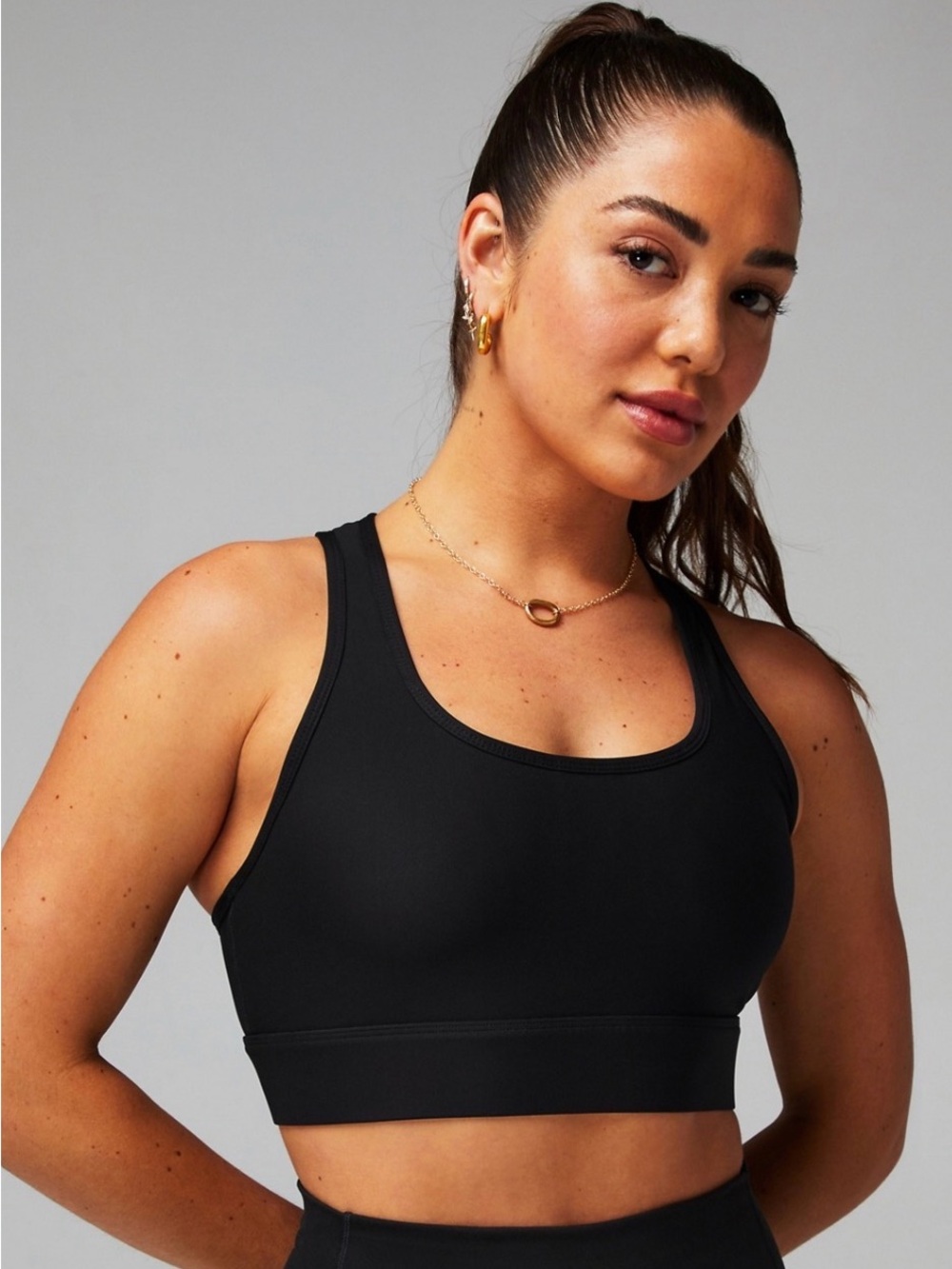 Fabletics On-The-Go Medium Impact Sports Bra in Black